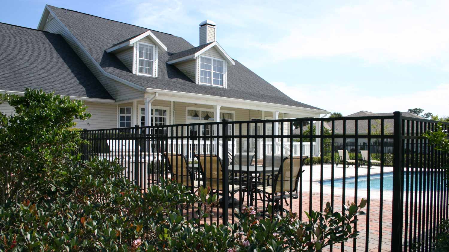 A colonial style home with a pool