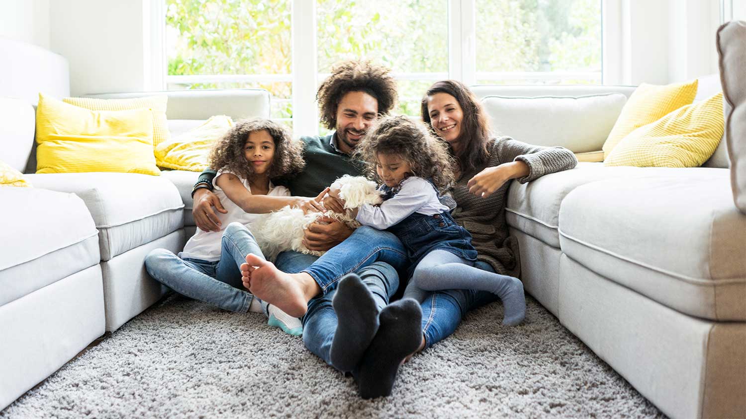Family lounging on carpet