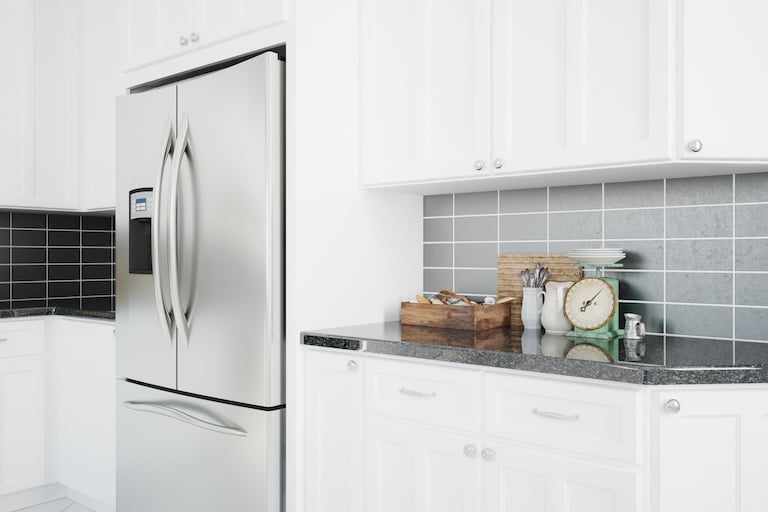 a silver refrigerator in a modern kitchen