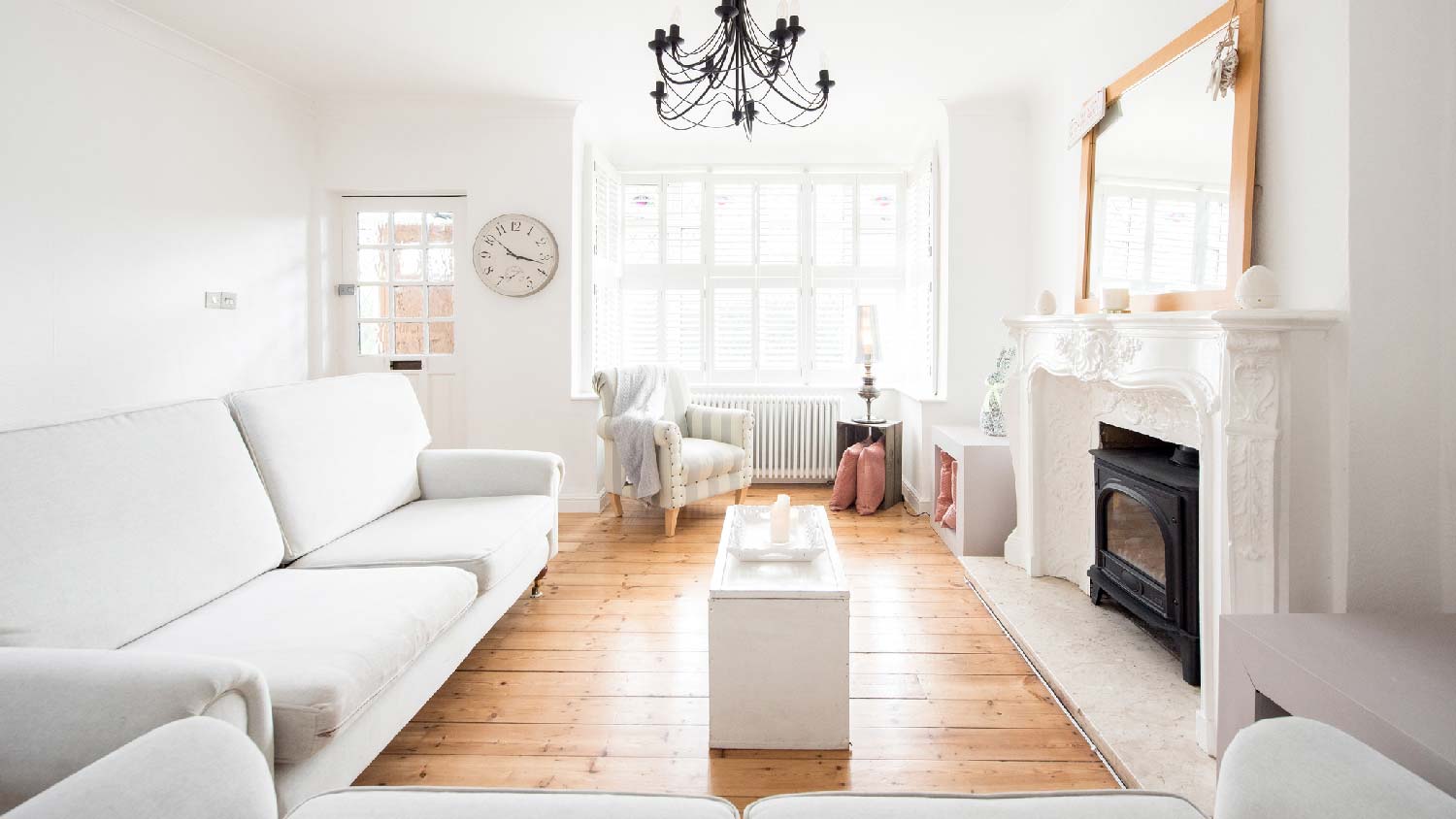 A sunny living space with white walls