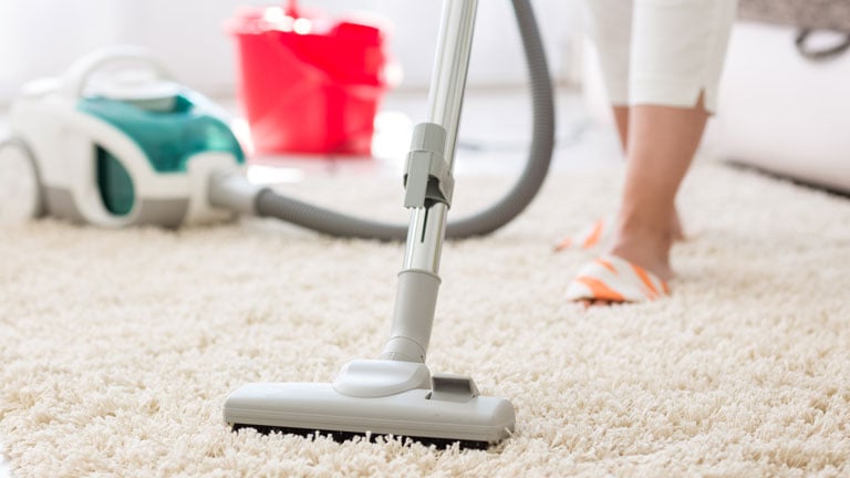 Suction grey carpet cleaning with vacuum cleaner